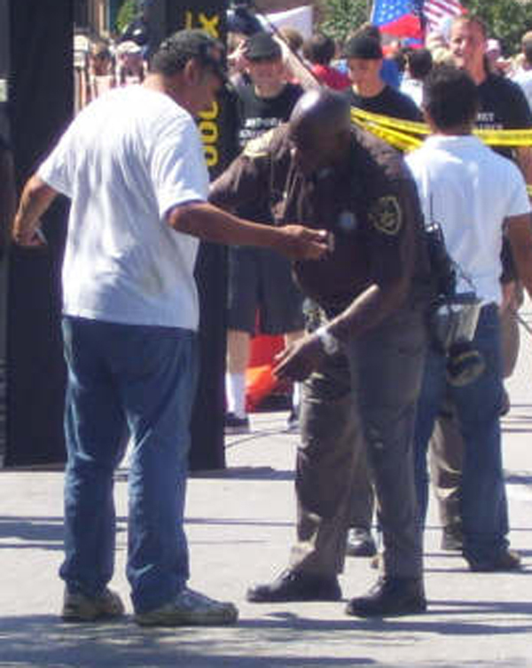 Omaha Riot Police pats down pedestrian 